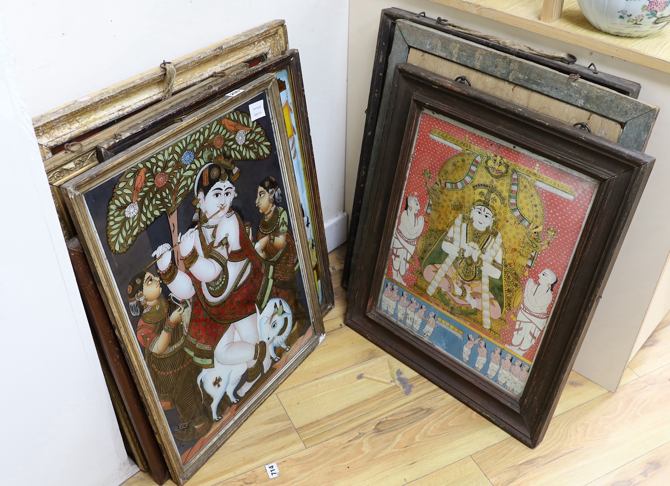 A collection of eight Indian reverse decorated glass pictures, 20th century, largest frame 70cm X 60cm